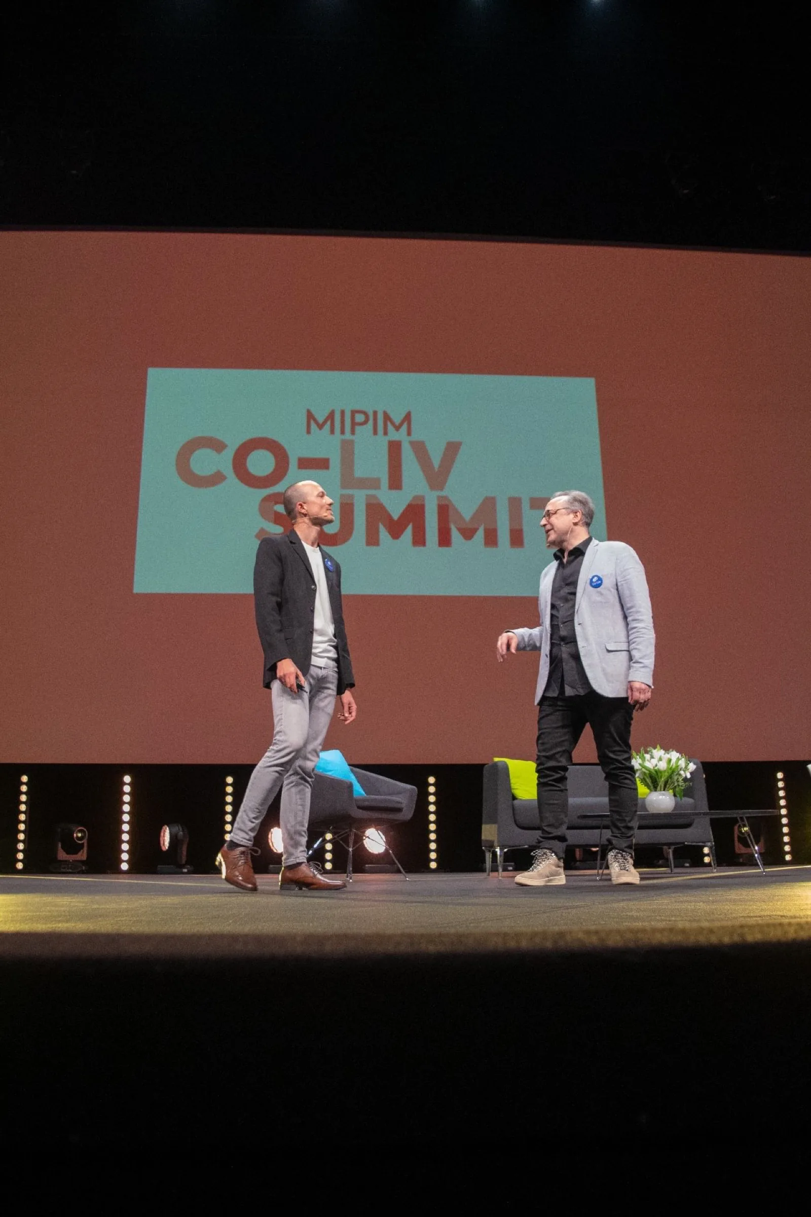 Two hosts on the MIPIM Co-Liv Summit stage