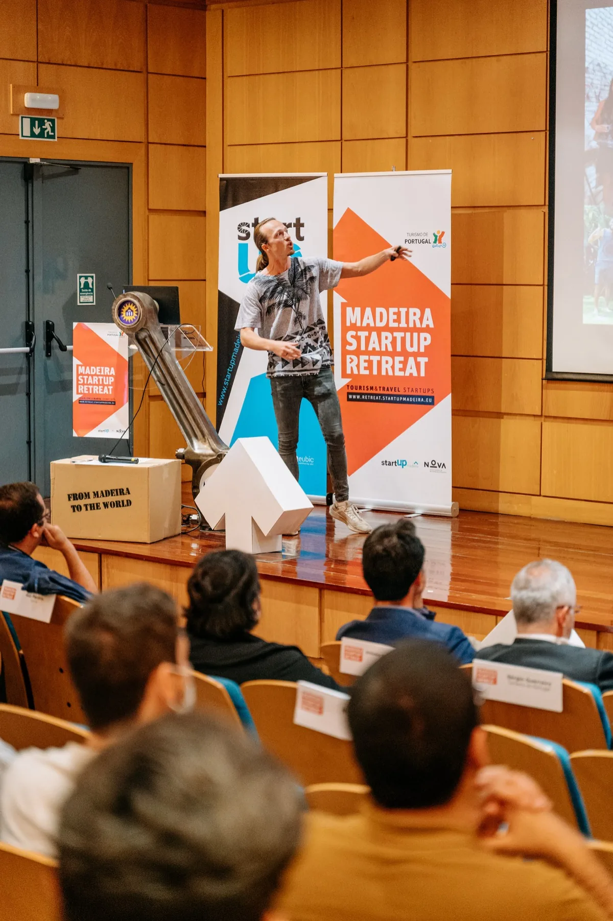 A Co-Liv talk in front of a seated audience